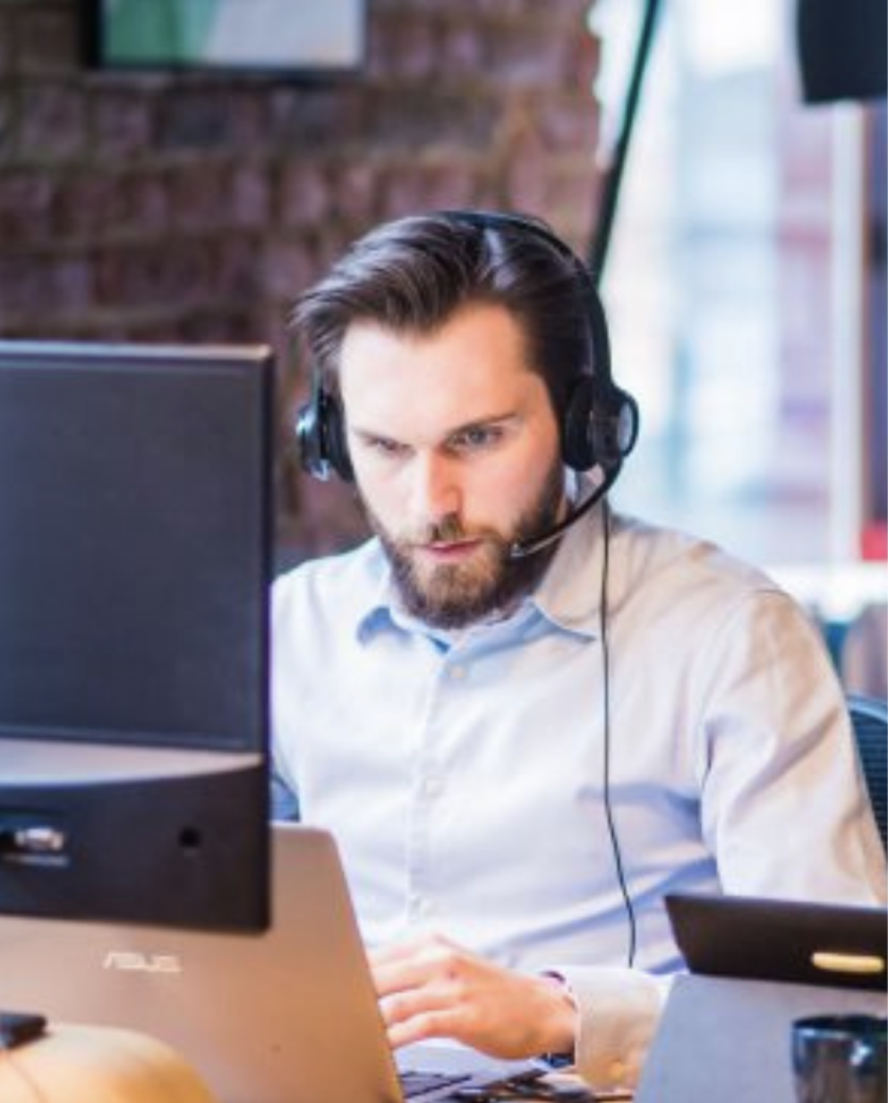 Man sitting infront of a computer